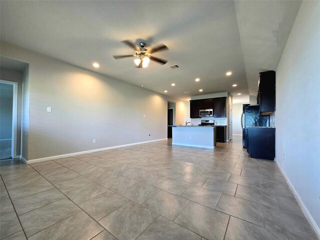 18411 Pelham Hollow Trl, Richmond, TX 77407 - unfurnished living room with recessed lighting, ceiling fan, baseboards, and light tile patterned flooring