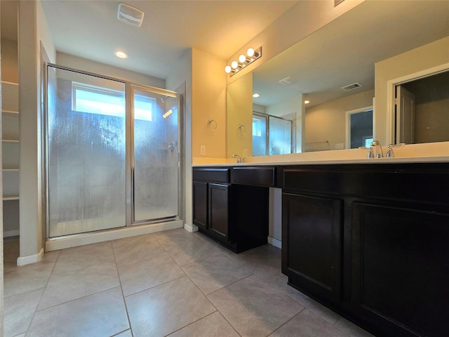 18411 Pelham Hollow Trl, Richmond, TX 77407 - bathroom featuring double vanity, a shower stall, tile patterned floors, and baseboards
