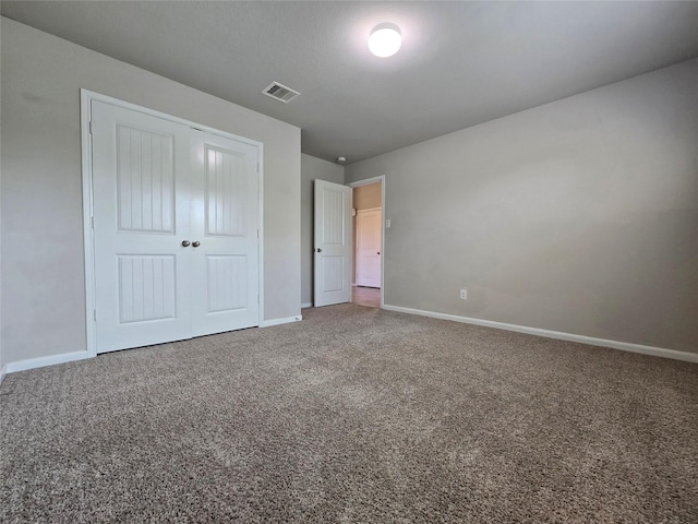 18411 Pelham Hollow Trl, Richmond, TX 77407 - unfurnished bedroom featuring carpet flooring, baseboards, and a closet