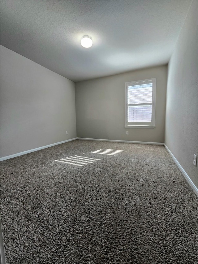 18411 Pelham Hollow Trl, Richmond, TX 77407 - carpeted spare room with baseboards