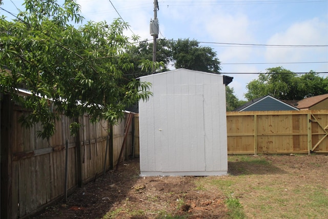 view of shed with a fenced backyard