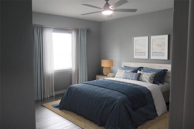 1115 W 4th St, Freeport, TX 77541 - bedroom with wood finished floors and ceiling fan