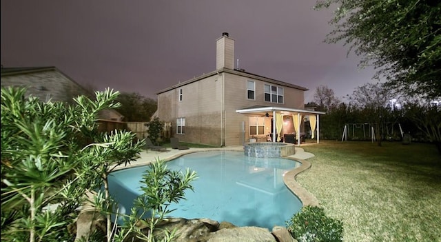 view of pool with a pool with connected hot tub and a patio area
