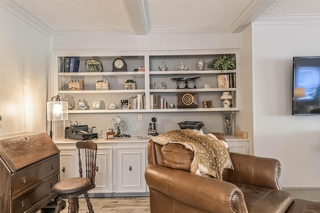 2607 E Pebble Beach Dr, Missouri City, TX 77459 - living area featuring a textured ceiling, light wood finished floors, and crown molding