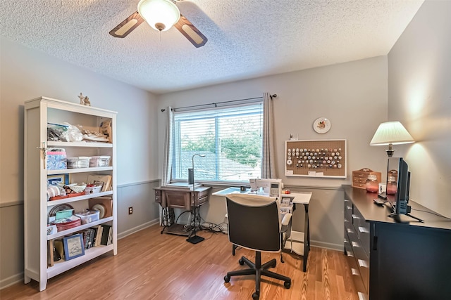 2607 E Pebble Beach Dr, Missouri City, TX 77459 - office area featuring a ceiling fan, light wood finished floors, a textured ceiling, and baseboards