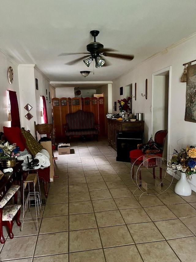 2923 Ellington St, Houston, TX 77088 - living room with ornamental molding, light tile patterned floors, and a ceiling fan