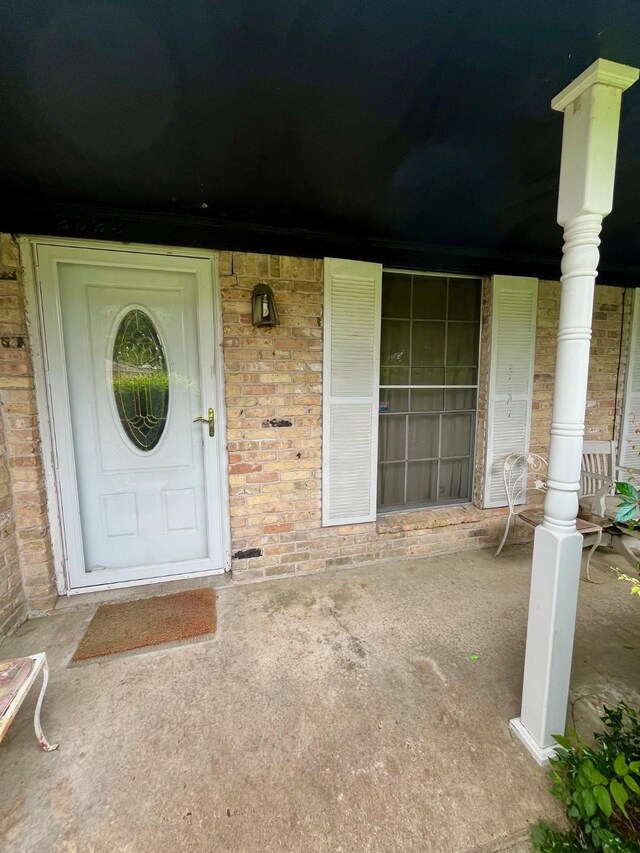 2923 Ellington St, Houston, TX 77088 - entrance to property with a porch and brick siding