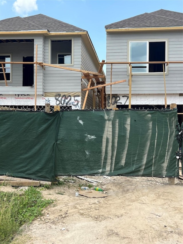 2923 Ellington St, Houston, TX 77088 - view of side of property with roof with shingles