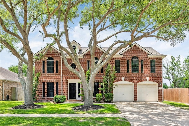 3413 Somerset Ln, Deer Park, TX 77536 - colonial-style house featuring driveway, brick siding, an attached garage, and a shingled roof