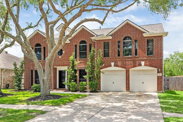 3413 Somerset Ln, Deer Park, TX 77536 - colonial-style house featuring brick siding, an attached garage, driveway, and a shingled roof