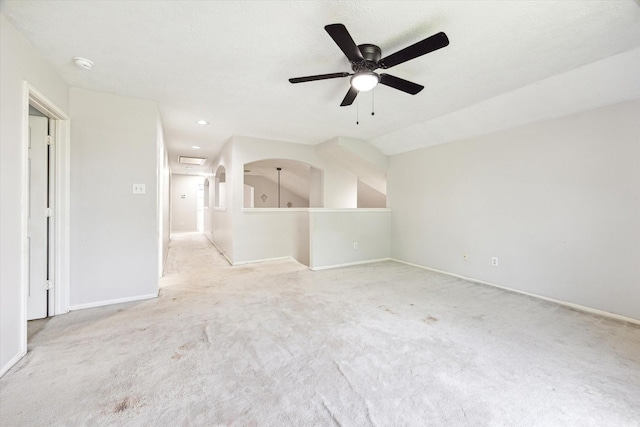 3413 Somerset Ln, Deer Park, TX 77536 - unfurnished living room with a ceiling fan, carpet, baseboards, arched walkways, and recessed lighting