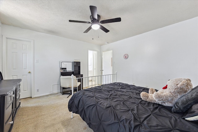 3413 Somerset Ln, Deer Park, TX 77536 - bedroom with light colored carpet, a textured ceiling, and a ceiling fan