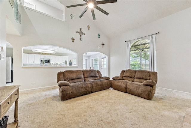 3413 Somerset Ln, Deer Park, TX 77536 - carpeted living area with ceiling fan, high vaulted ceiling, arched walkways, and baseboards