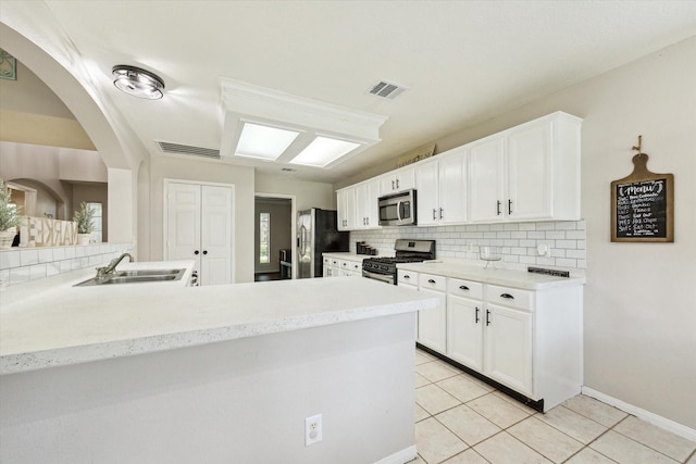 3413 Somerset Ln, Deer Park, TX 77536 - kitchen featuring stainless steel appliances, tasteful backsplash, a sink, and light tile patterned floors