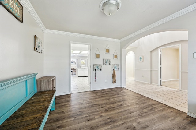 3413 Somerset Ln, Deer Park, TX 77536 - entrance foyer featuring ornamental molding, arched walkways, wood finished floors, and baseboards