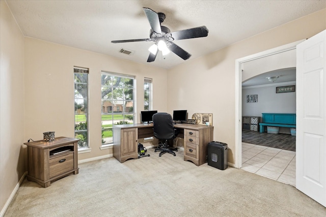 3413 Somerset Ln, Deer Park, TX 77536 - office area featuring light colored carpet, ceiling fan, baseboards, and arched walkways