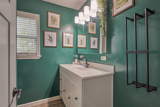 bathroom with vanity and baseboards