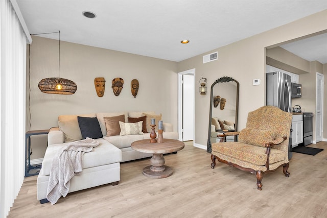 12900 Walden Rd Unit 715G, Montgomery, TX 77356 - living room featuring light wood finished floors, baseboards, and recessed lighting
