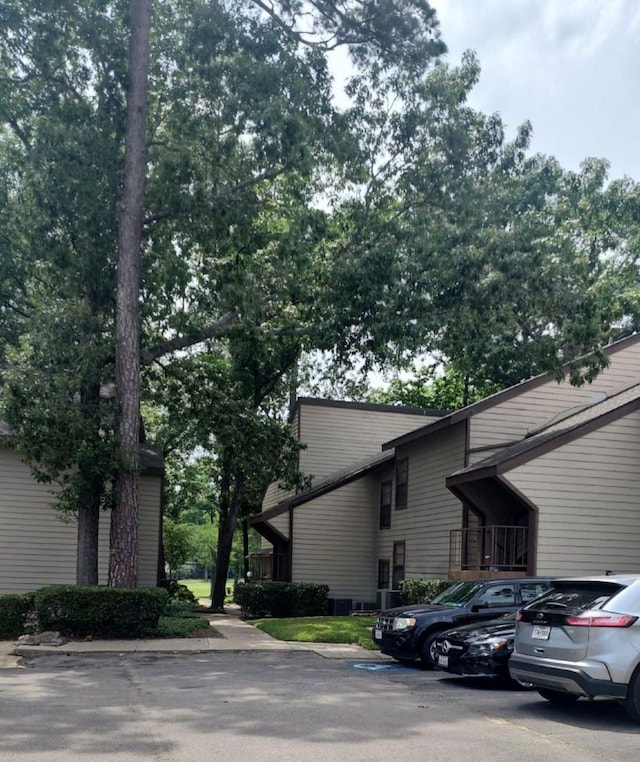 12900 Walden Rd Unit 715G, Montgomery, TX 77356 - view of home's exterior with uncovered parking