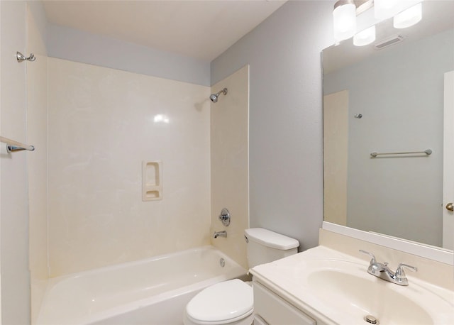 bathroom featuring toilet, bathtub / shower combination, and vanity