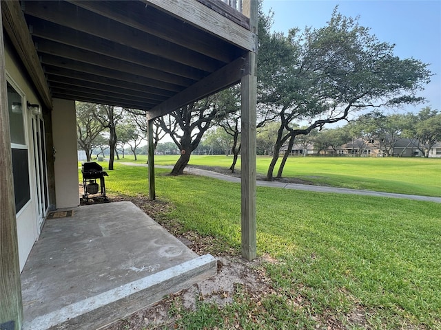 221 Marion Dr Unit 107C, Rockport, TX 78382 - view of green lawn featuring a patio