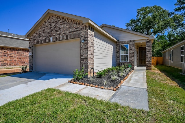 27638 Mesabe Dr, Magnolia, TX 77354 - view of front of home featuring a garage, driveway, and a front yard
