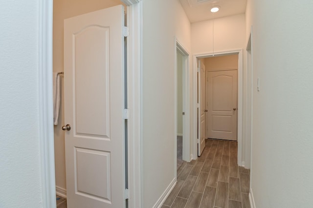 27638 Mesabe Dr, Magnolia, TX 77354 - hallway with baseboards, attic access, and dark wood-style flooring