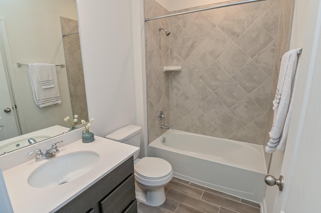 27638 Mesabe Dr, Magnolia, TX 77354 - bathroom with wood finish floors, toilet, bathing tub / shower combination, and vanity