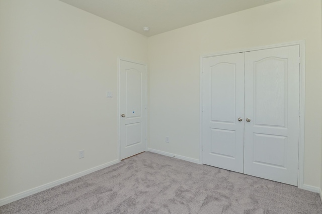 27638 Mesabe Dr, Magnolia, TX 77354 - unfurnished bedroom with carpet flooring, baseboards, and a closet