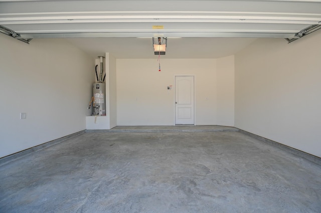 27638 Mesabe Dr, Magnolia, TX 77354 - garage featuring gas water heater and a garage door opener