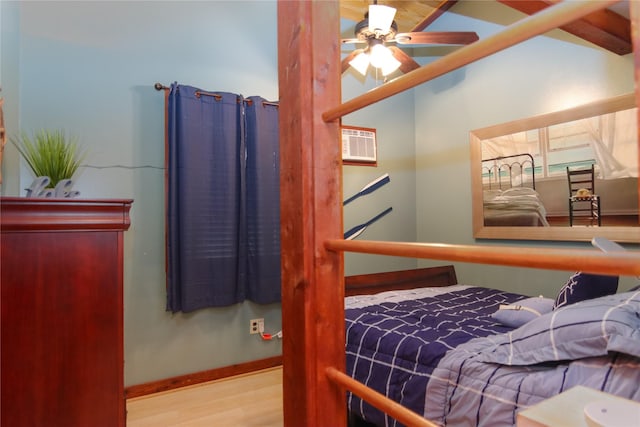 302 Bluebonnet Rd, Sheridan, TX 78950 - bedroom with wood finished floors and baseboards