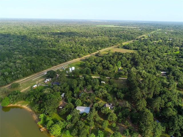 302 Bluebonnet Rd, Sheridan, TX 78950 - aerial overview of property's location featuring a heavily wooded area and a nearby body of water