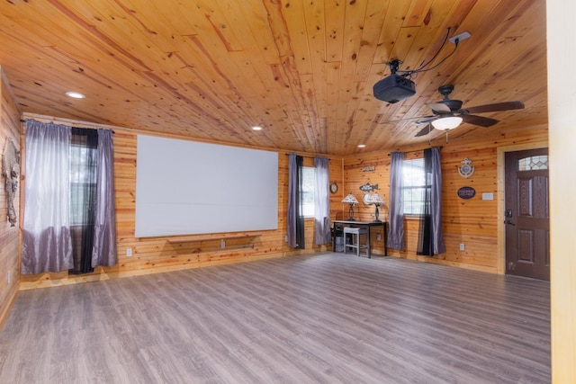 134 Magnolia Point Dr, Houston, TX 77336 - unfurnished living room featuring wooden ceiling, wood finished floors, wood walls, recessed lighting, and ceiling fan