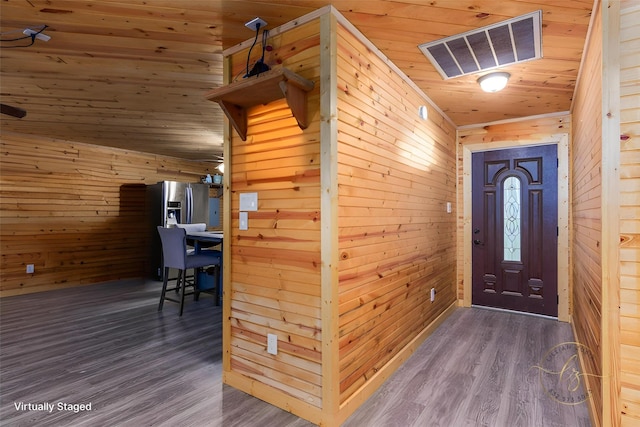 134 Magnolia Point Dr, Houston, TX 77336 - foyer with wooden walls, wooden ceiling, and wood finished floors