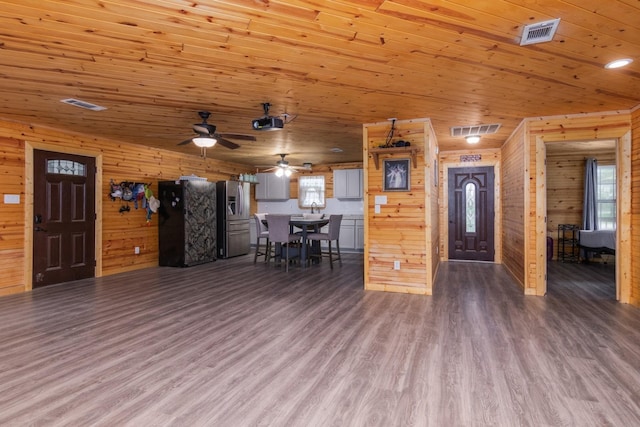134 Magnolia Point Dr, Houston, TX 77336 - living area featuring wood finished floors, a ceiling fan, wooden walls, and wooden ceiling