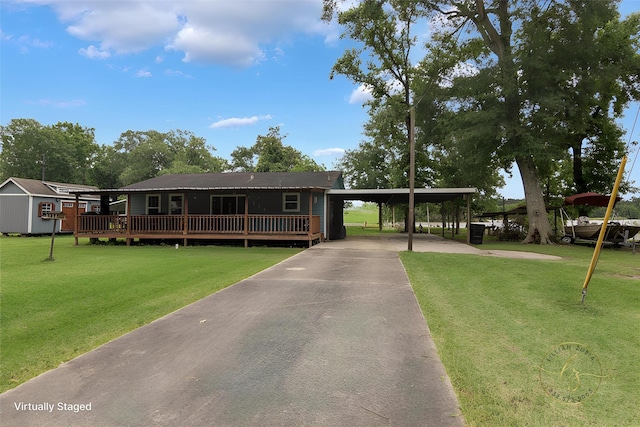 134 Magnolia Point Dr, Houston, TX 77336 - view of front of house featuring asphalt driveway, a front yard, and an attached carport