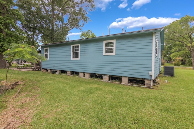 134 Magnolia Point Dr, Houston, TX 77336 - rear view of property with a lawn and central AC unit