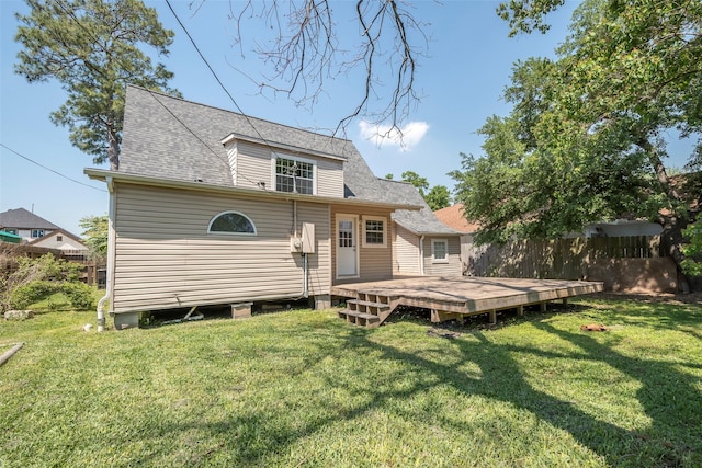 1109 Dismuke St, Houston, TX 77023 - back of property featuring a wooden deck and a shingled roof