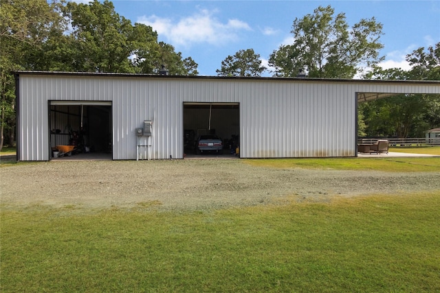 79 E Pine Dr, Huffman, TX 77336 - view of pole building with driveway and a yard