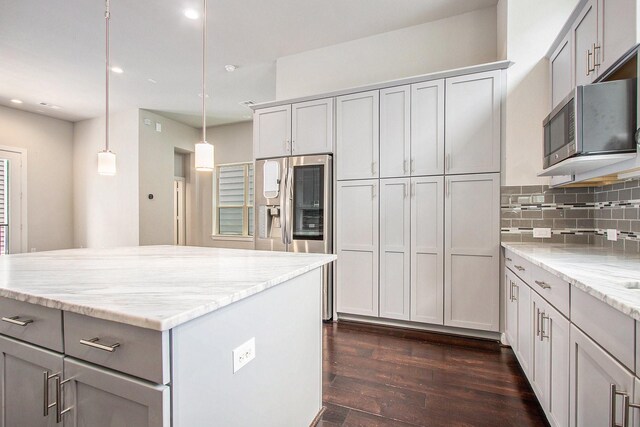 2422 Maufferd, Houston, TX 77009 - kitchen featuring stainless steel appliances, dark wood finished floors, decorative backsplash, recessed lighting, and light stone counters