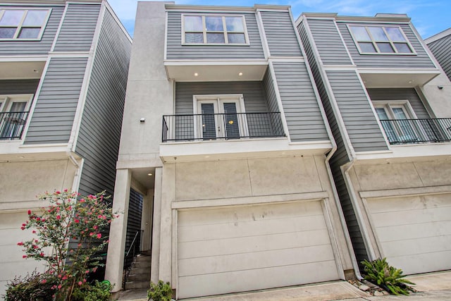 2422 Maufferd, Houston, TX 77009 - multi unit property with a balcony, a garage, and stucco siding