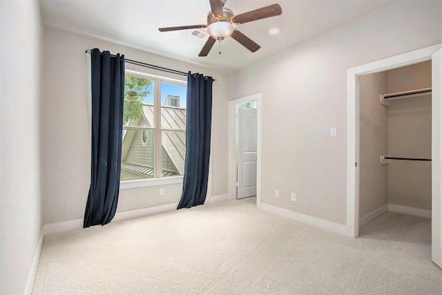 2422 Maufferd, Houston, TX 77009 - unfurnished bedroom with carpet, a walk in closet, and a ceiling fan