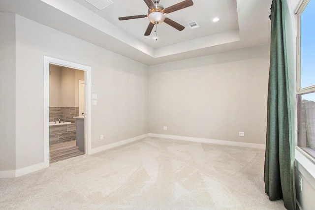 2422 Maufferd, Houston, TX 77009 - unfurnished room with light carpet, ceiling fan, recessed lighting, and a raised ceiling
