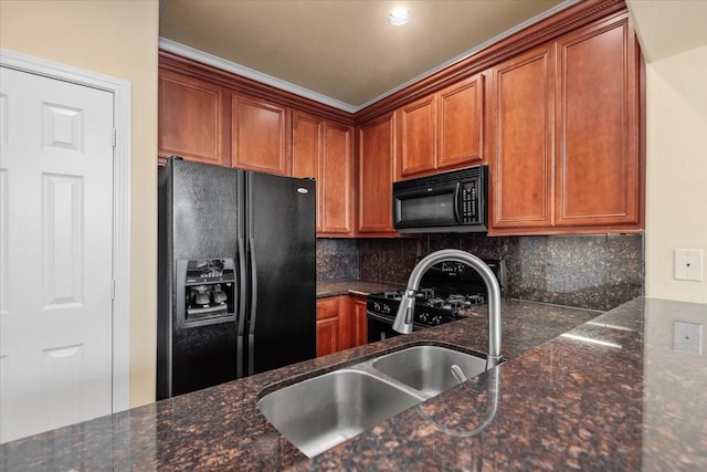1774 Aden Dr, Houston, TX 77003 - kitchen featuring black appliances, a sink, tasteful backsplash, and brown cabinets