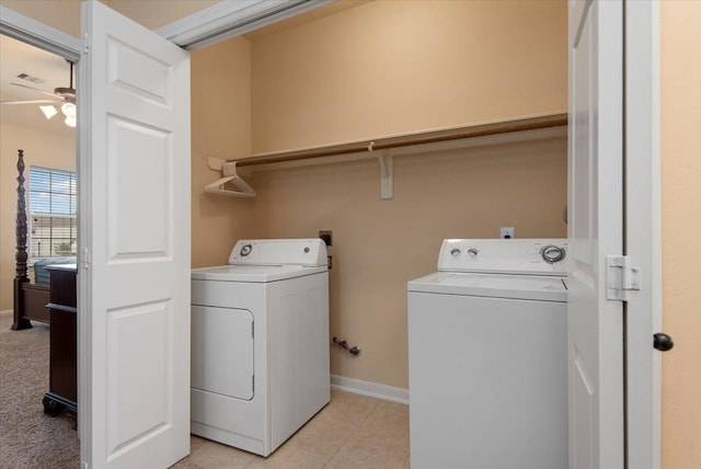1774 Aden Dr, Houston, TX 77003 - laundry room with washing machine and clothes dryer, ceiling fan, and baseboards
