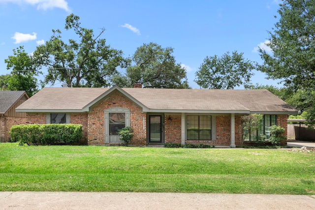 10139 Knoboak Dr, Houston, TX 77080 - view of front of house featuring a front yard, brick siding, a chimney, and a shingled roof