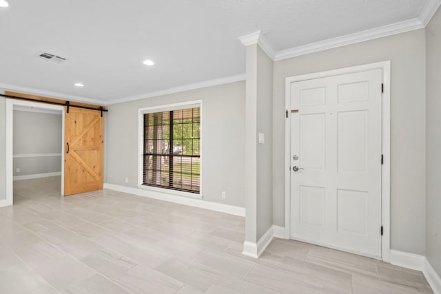 10139 Knoboak Dr, Houston, TX 77080 - foyer with a barn door, crown molding, baseboards, and recessed lighting