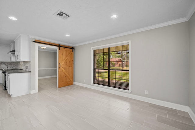 10139 Knoboak Dr, Houston, TX 77080 - unfurnished living room featuring a barn door, recessed lighting, ornamental molding, and baseboards