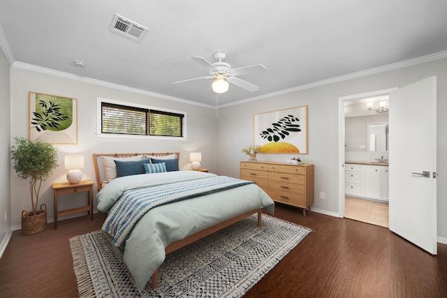 10139 Knoboak Dr, Houston, TX 77080 - bedroom featuring ornamental molding, baseboards, wood finished floors, ensuite bath, and a sink