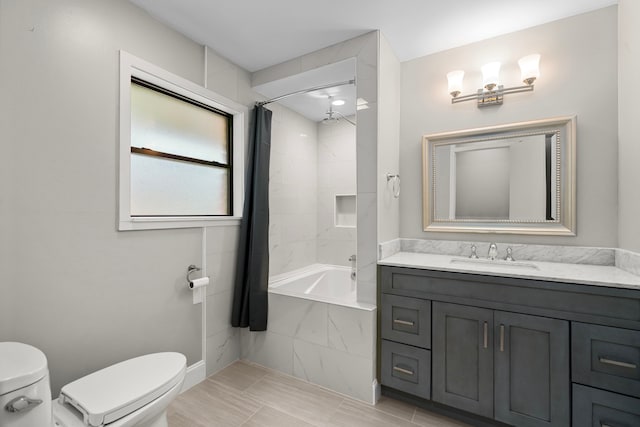 10139 Knoboak Dr, Houston, TX 77080 - bathroom featuring toilet, vanity, and a combined bath / shower with marble appearance